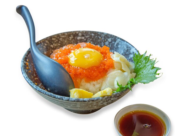 Japanese rice bowl with sliced salmon sashimi Soft-boiled eggs, Shrimp Roe with Seafood Sauce, focus selective