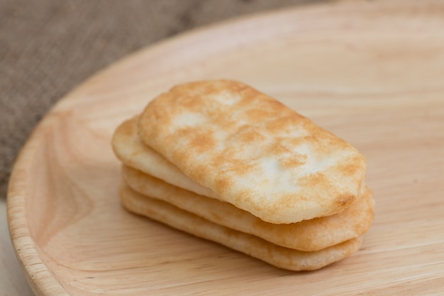 japanese rice cracker on wooden plate.