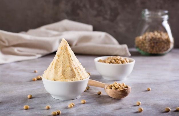 Japanese seasoning miso fermented from soy and koji rice in a bowl on the table