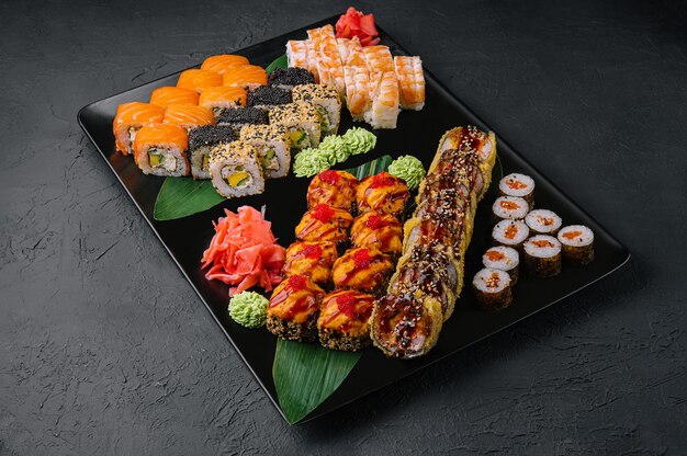 Japanese sushi assorted on a black stone plate