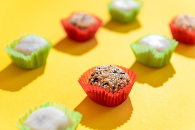 Japanese sweets mochi in factory packaging on a yellow background