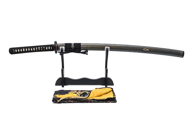 Japanese sword with textured scabbard with black cord on wooden stand.