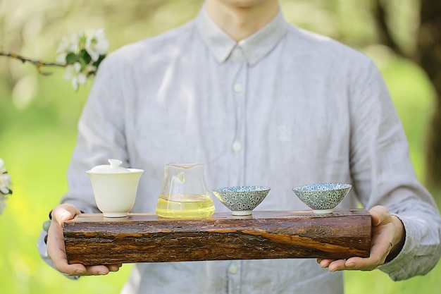 japanese tea ceremony in the spring garden, aroma cherry blossom sakura in asia