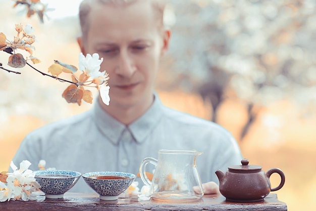 japanese tea ceremony in the spring garden, aroma cherry blossom sakura in asia