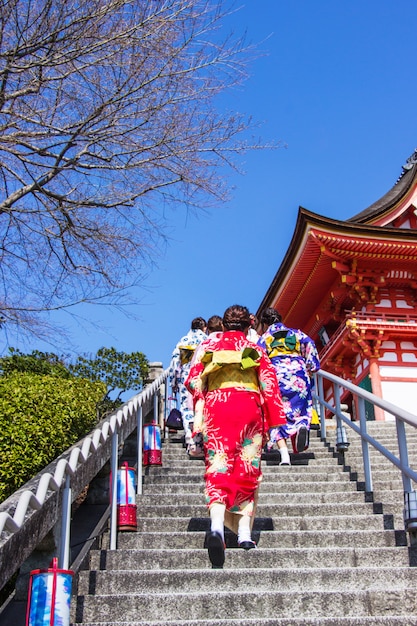 Japanese tourists and foreigners put on a dress yukata for visit the inside the Kiyomizu-dera temple