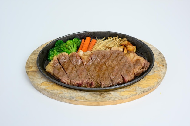 Japanese wagyu beef slices set with vegetables on wooden tray