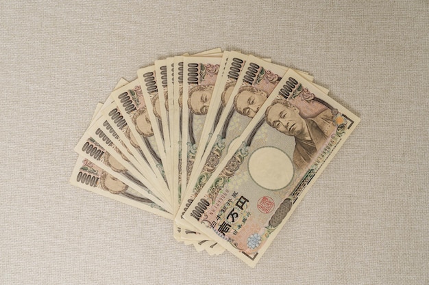 Japanese Yen banknote stack Thousand Yen money Japan cash Tax Recession Economy Inflation Investment finance and shopping payment concepts