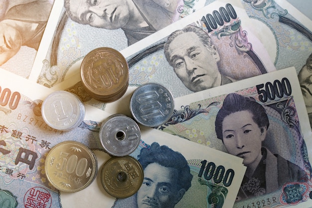 Japanese yen notes and Japanese yen coins for money concept background