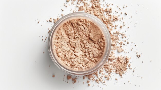 Photo jar of beige protein powder with scattered powder on a white background