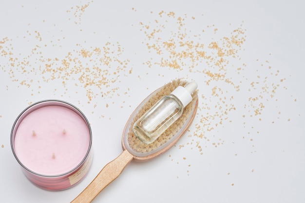 A jar of cosmetics sitting on top of a spoon