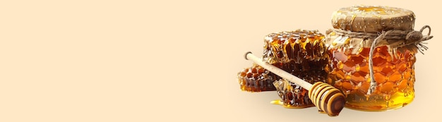 Photo jar of honey honey stick and honeycomb on a beige background with space for text created with generative ai technology