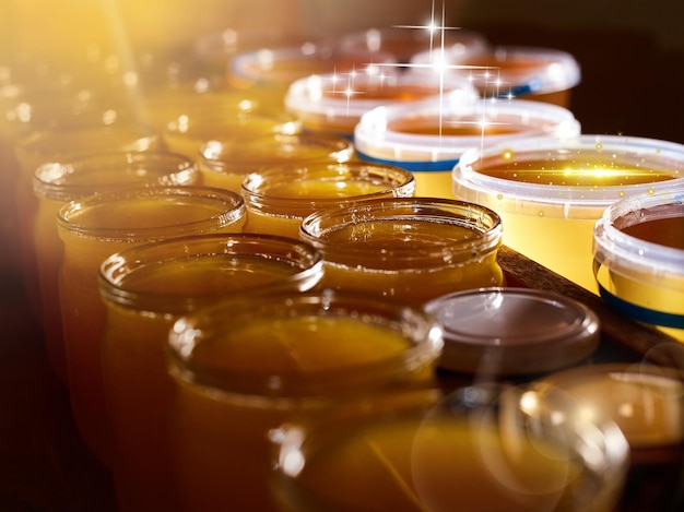 A jar of sweet honey in barrels are stored on a shelf in the pantry sweet food and delicious