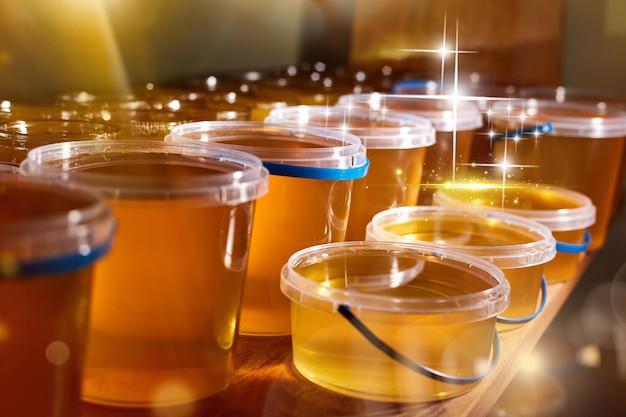 A jar of sweet honey in barrels are stored on a shelf in the pantry sweet food and delicious