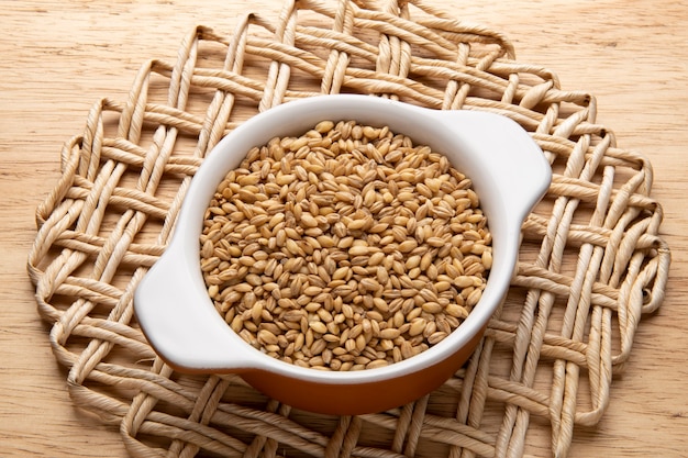 Jar with grain - raw ingredient for preparing dishes - barley