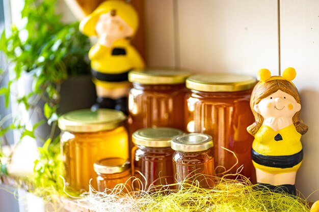 Photo jars of different honey varieties stocked on a shelf