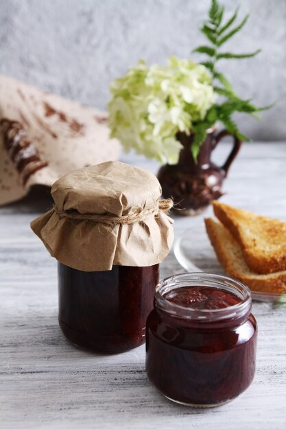 Jars of strawberry jam. Homemade sweets