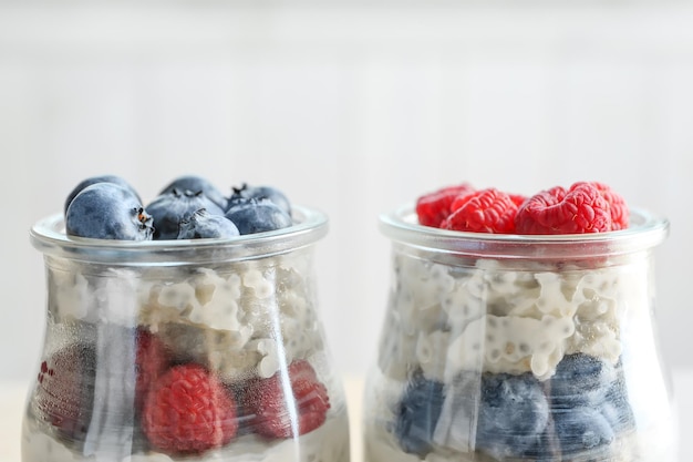 Jars with delicious chia seed pudding close up