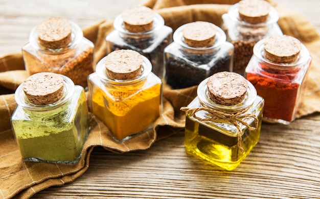 Jars with dried herbs, spices on the table