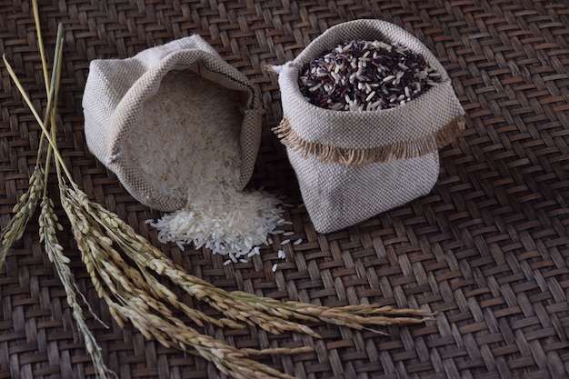 jasmine rice in burlap bag on weave texture background