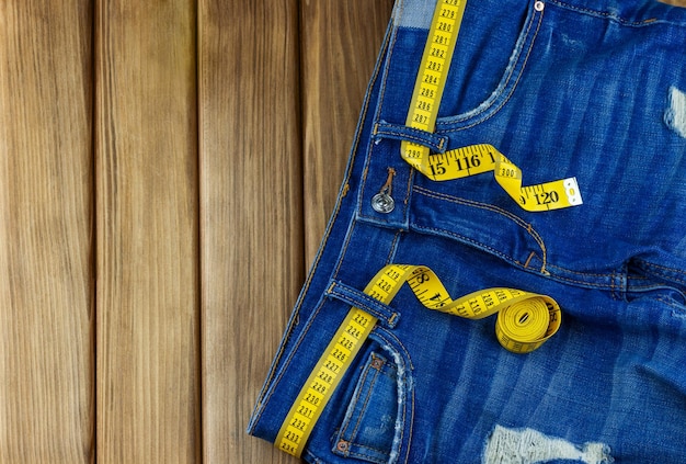 Jeans with measuring tape as a belt