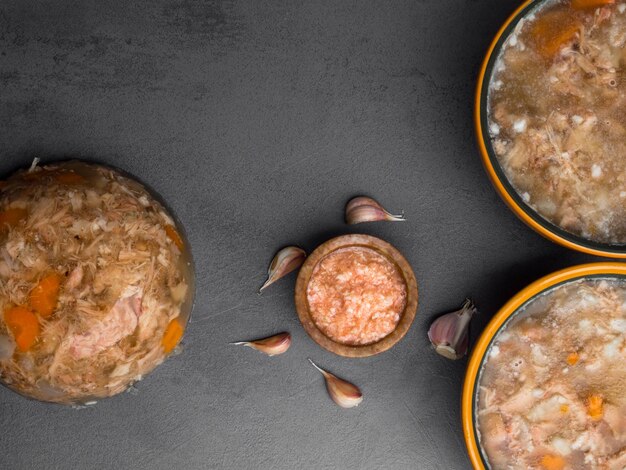 Jellied pork and beef with carrots mustard on background