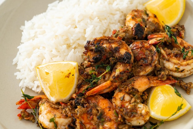 jerk shrimps or grilled shrimps in Jamaica style with lemon and rice