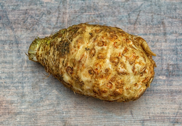 Jerusalem artichoke on the wooden surface