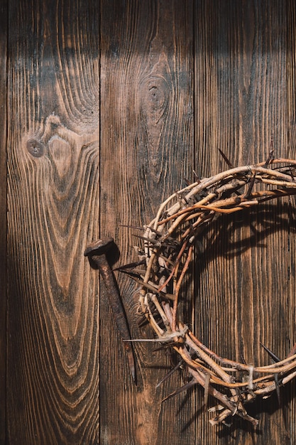 Jesus Crown Thorns and nails and cross on a wood background Crucifixion Of Jesus Christ Passion Of Jesus Christ Concept for faith spirituality and religion Easter Day