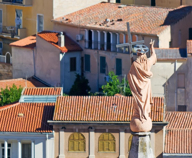 Jesus statue over Ozieri roofs