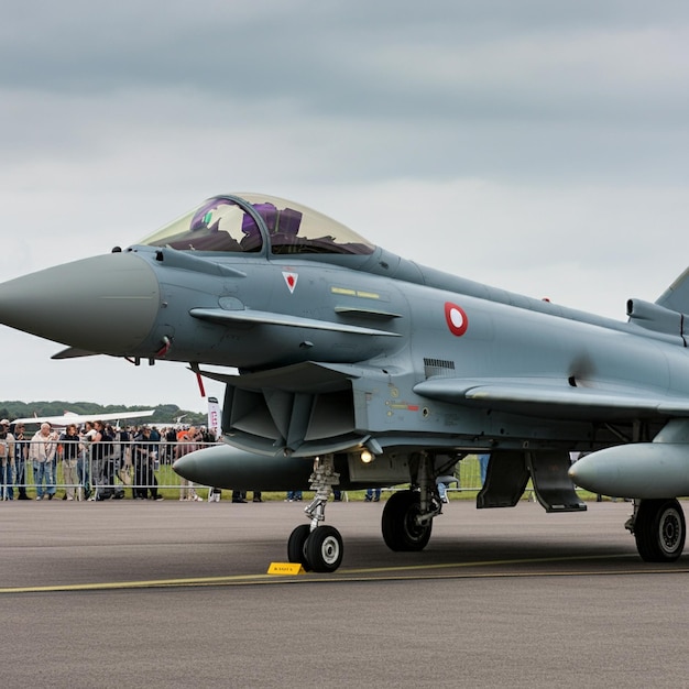 a jet with a red circle on the nose is on the runway