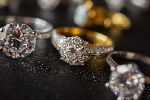 Jewelry diamond rings set on black background close up