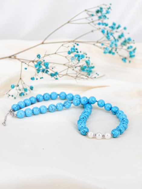 jewelry made of blue natural stone on a white elegant background