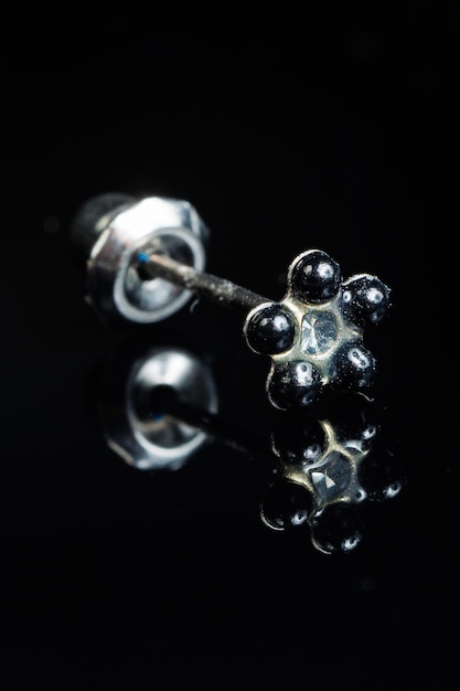 Jewelry with stone earrings luxury silver earrings with diamonds sapphires on a black background