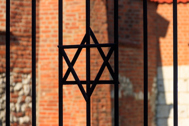 Jewish star of David on the metal fence