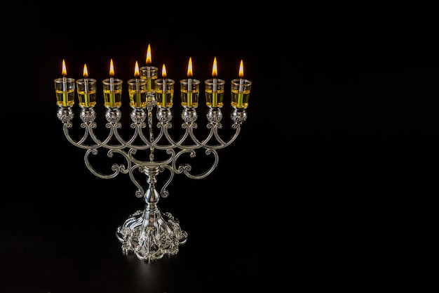 Jewish traditional lights holiday symbol Hanukkah Judaism menorah with are burning oil candles