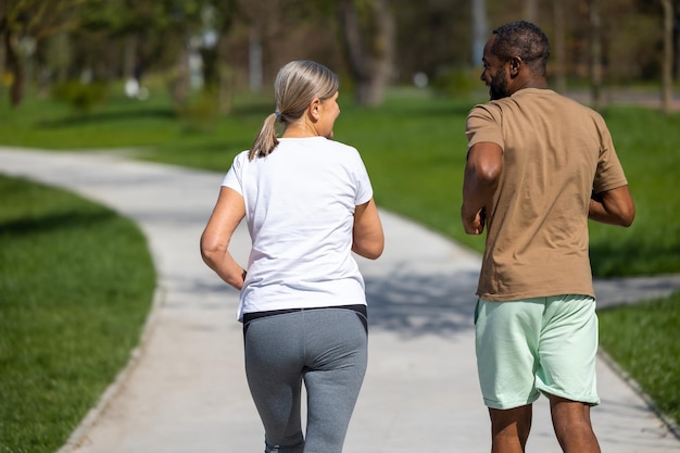 Jogging Mature couple jogging in the park together