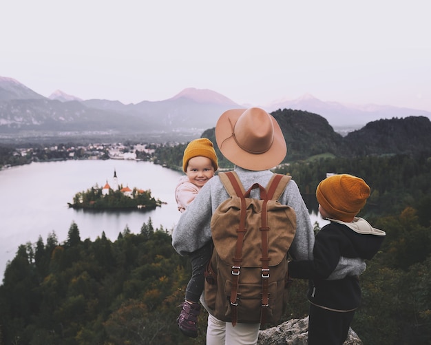 Photo journey slovenia with kids family travel europe hiker woman with children on bled lake