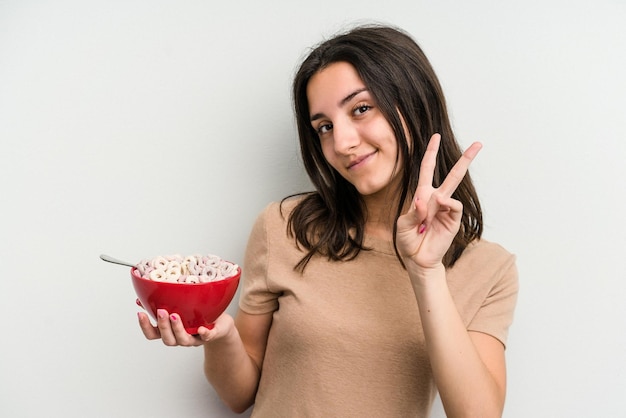 Joyful and carefree showing a peace symbol with fingers