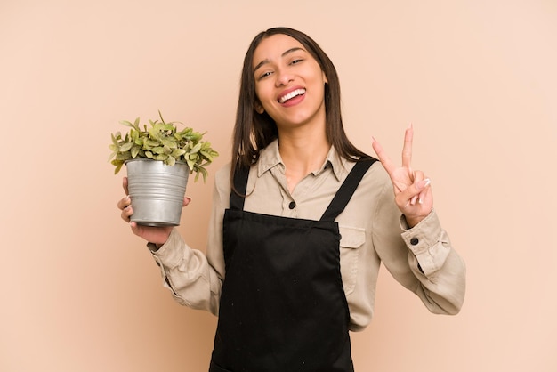 Joyful and carefree showing a peace symbol with fingers