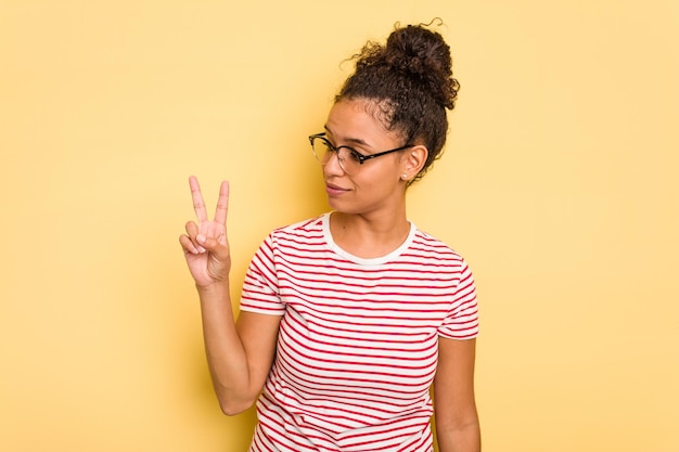 Joyful and carefree showing a peace symbol with fingers