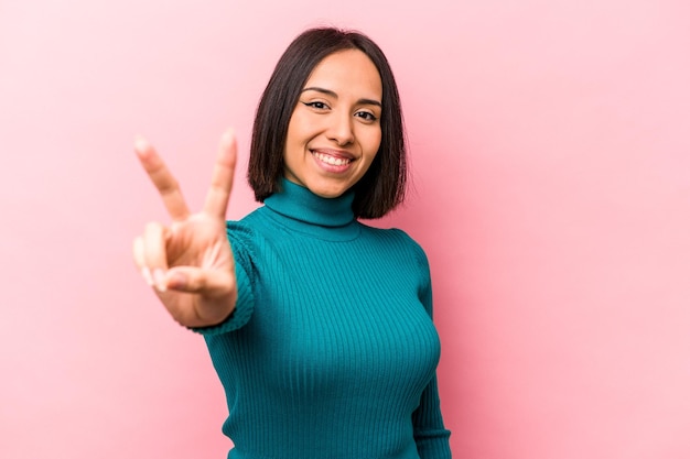 Joyful and carefree showing a peace symbol with fingers