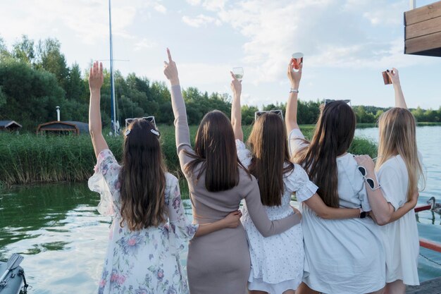 A joyful celebratory friends gathering by the water wonderful moments enthusiastically captured