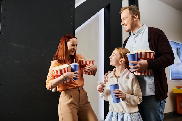 Joyful family enjoying popcorn