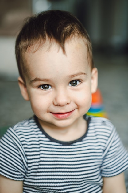 Joyful little boy with a radiant smile A little boy that is smiling for the camera