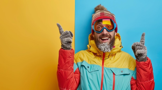 Photo a joyful man wearing a vibrant winter jacket and accessories celebrates in a playful manner surrounded by bold colors that contrast with his warm attire