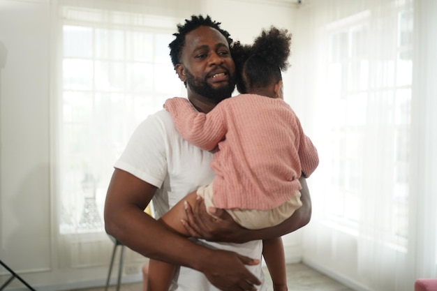 Joyful multiethnic family father and daughter and their leisure at home