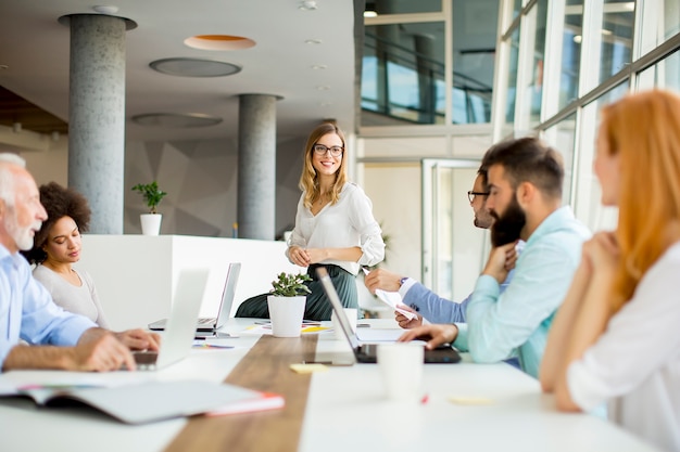 Joyful multiracial business team at work in modern office