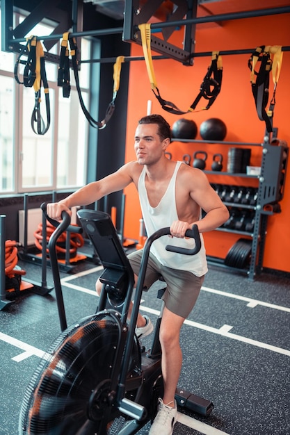 Joyful positive man enjoying his cardio training