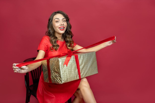 Joyful woman on a red background