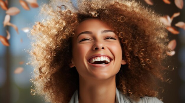 A joyful woman with curly hair laughing and smiling radiating happiness and positivity